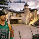Eddie House, former NBA player known for three-point shooting, wearing a Boston Celtics jersey and holding a basketball.