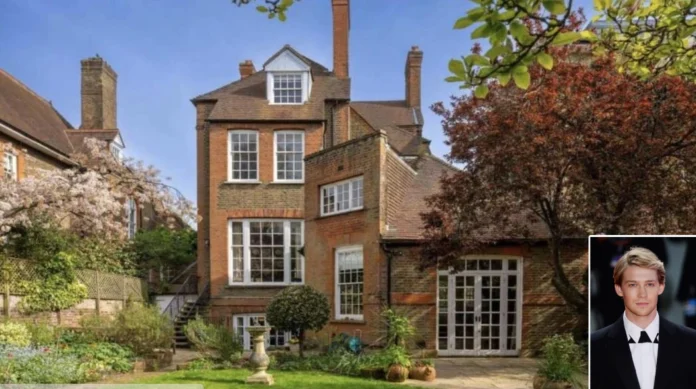 Joe Alwyn house exterior in Highgate London with brick design and garden.