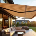 Modern retractable markiseteppe shading a cozy outdoor patio with wooden furniture.