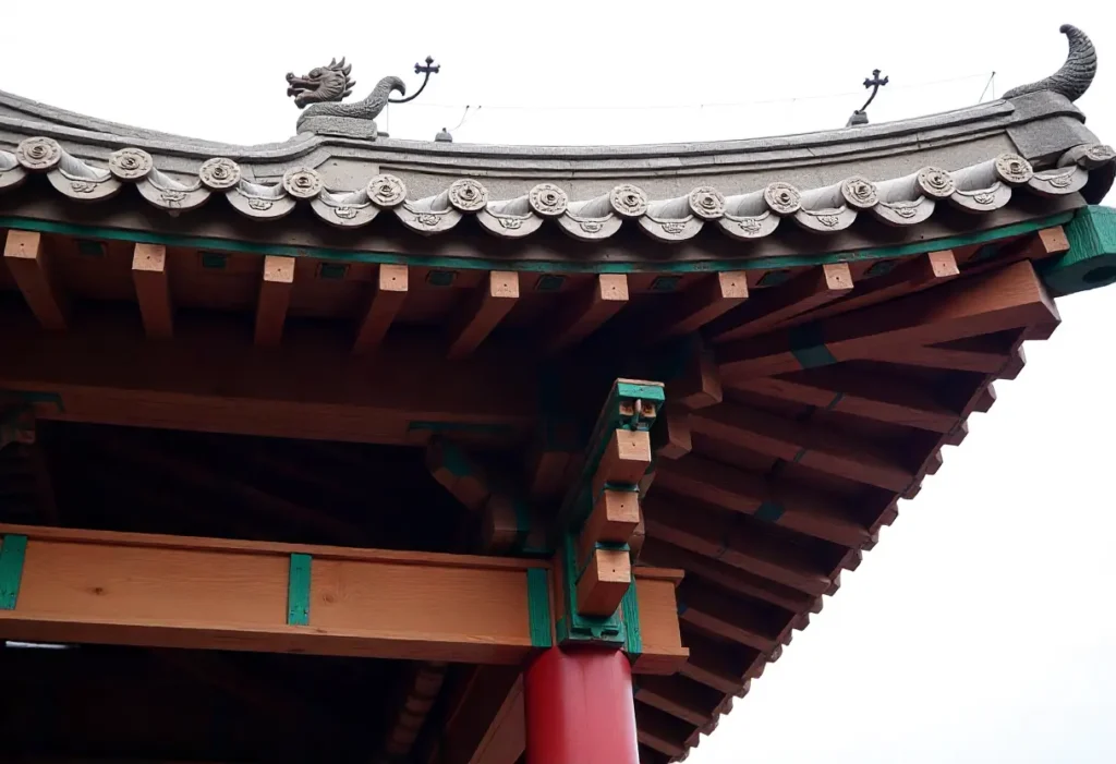 Close-up of a traditional Chinese wooden roof with ornate eaves, colorful tiles, and dragon motifs showcasing intricate joinery.