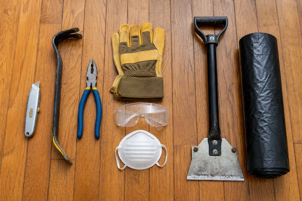 Tools needed to remove old carpet before installing new flooring.